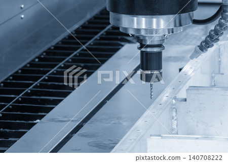 High-precision CNC milling machine performing a hole threading process on an EV battery frame with a tapping tool. High-precision CNC milling machine performing a hole threading process on an EV battery frame with a tapping tool. 140708222