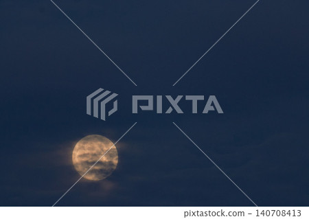 The May full moon, shrouded in clouds. The May full moon, shrouded in clouds. 140708413