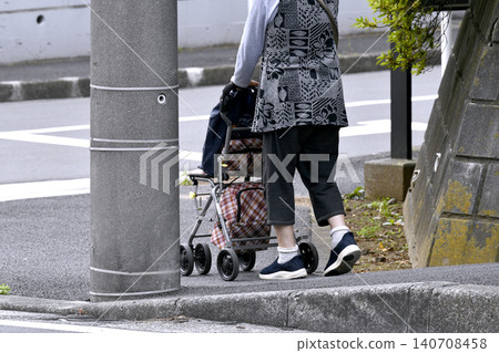 Steps in the urban landscape of Yokohama, Japan... Elderly woman using a mobility scooter... Stools are popular... Aging society... = 23rd Steps in the urban landscape of Yokohama, Japan... Elderly woman using a mobility scooter... Stools are popular... Aging society... = 23rd 140708458