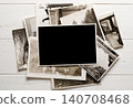 Lots of old vintage photos. Copy space. White wooden background 140708468
