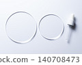Glass circles on a blue background. A template for placing samples of cosmetics or medical products or food. 140708473