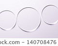 Glass circles on a pink background. A template for placing samples of cosmetics or medical products or food. 140708476