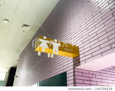 Modern toilet and restroom sign overhead showing facilities for male or female Modern toilet and restroom sign overhead showing facilities for male or female 140708534