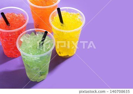Colorful Frozen Slush Drinks in Plastic Cups Colorful Frozen Slush Drinks in Plastic Cups 140708635