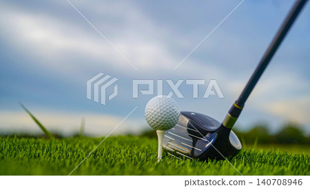Golf clubs and balls on a green lawn in a beautiful golf course with morning sunshine. 140708946