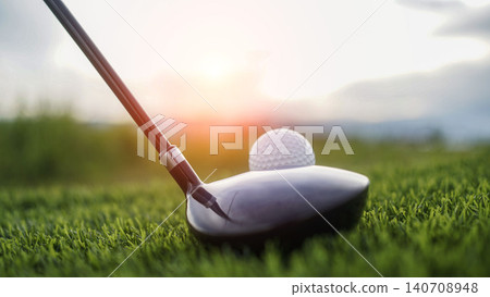 Golf clubs and balls on a green lawn in a beautiful golf course with morning sunshine. 140708948