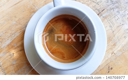 Top view of a cup of bitter black coffee. Top view of a cup of bitter black coffee. 140708977