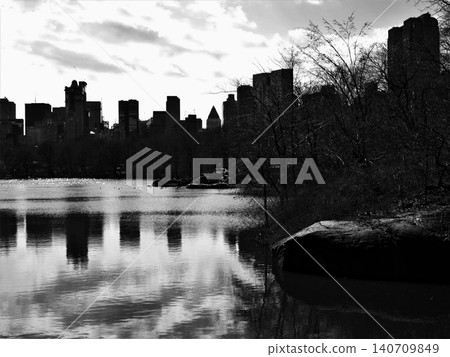 Central park lake reflecting new york city skyline Central park lake reflecting new york city skyline 140709849