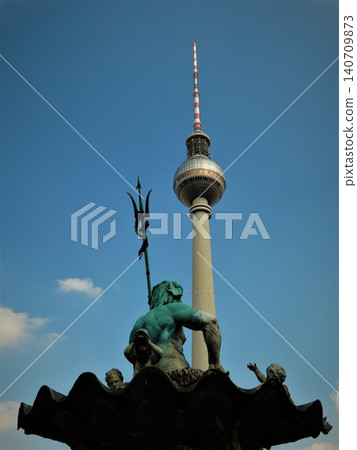 Neptune fountain and berlin tv tower against blue sky 140709873
