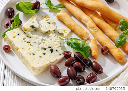 Premium blue cheese plate with grissini and olives 140709935