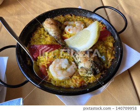 Seafood and chicken paella, Spanish lunch Seafood and chicken paella, Spanish lunch 140709958