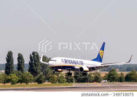 Ryanair Boeing 737 passenger airplane landing on the runway Ryanair Boeing 737 passenger airplane landing on the runway 140710075