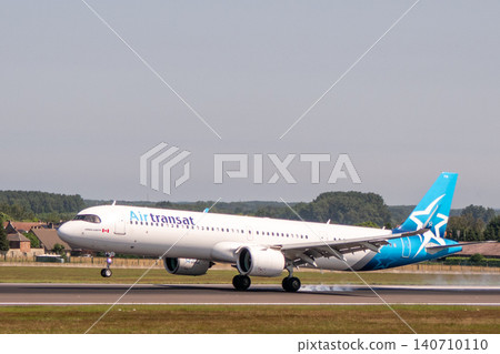 Air Transat Airbus A321LR airplane landing on runway Air Transat Airbus A321LR airplane landing on runway 140710110