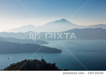 Sun Moon Lake layered mountain vista in Taiwan Sun Moon Lake layered mountain vista in Taiwan 140710204