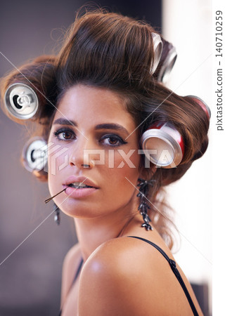 Haircare, rollers and woman with glamour, portrait and creative for curling with cans for soda on head. Adult, girl and female person with confidence of style, texture and model with aesthetic 140710259
