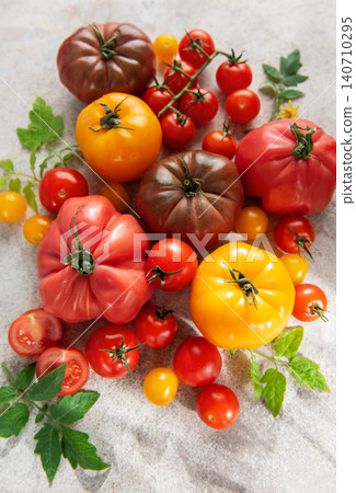 Colorful heirloom tomatoes displaying organic garden freshness Colorful heirloom tomatoes displaying organic garden freshness 140710295