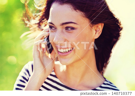 Woman, happy and phone call with communication outdoor for conversation, networking and mobile chat with bokeh. Person, smile and smartphone in nature for talking, discussion or listening in sunlight Woman, happy and phone call with communication outdoor for conversation, networking and mobile chat with bokeh. Person, smile and smartphone in nature for talking, discussion or listening in sunlight 140710377