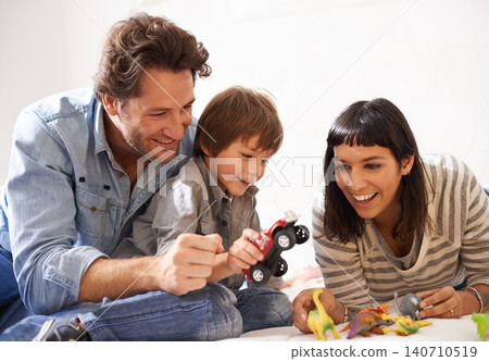 Happy, family and child playing in living room together for bonding, having fun and entertainment in home. Childhood development, Australian man and woman with boy kid for smile, laugh and toys 140710519