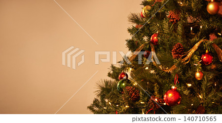 Studio, christmas and decoration with tree, pine and icon for holiday celebration. Ornament, plant and winter for cedar, symbol or tradition for vacation break and season cheer on wall background 140710565