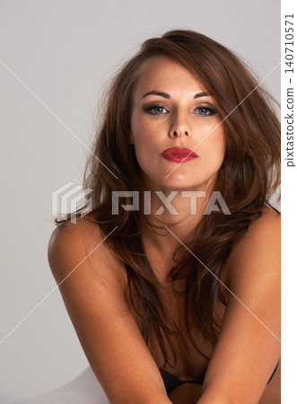 Beauty, portrait and makeup for woman in studio, confident and proud of glow of face with shine. Adult, female person and girl with aesthetic for cosmetics, relax and dermatology for skin of model Beauty, portrait and makeup for woman in studio, confident and proud of glow of face with shine. Adult, female person and girl with aesthetic for cosmetics, relax and dermatology for skin of model 140710571