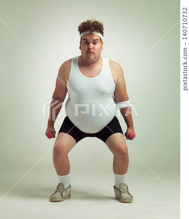 Man, portrait and dumbbell in studio for squat, plus size and exercise for weight loss on background. Male person, training and gym equipment for health, challenge and body development for fitness Man, portrait and dumbbell in studio for squat, plus size and exercise for weight loss on background. Male person, training and gym equipment for health, challenge and body development for fitness 140710732