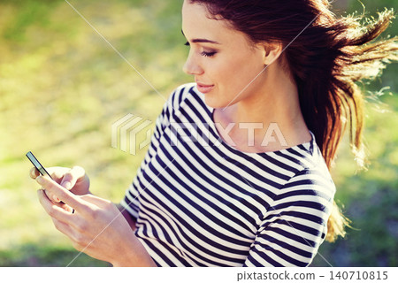 Happy woman, cellphone and networking to relax in nature and typing a message for connection. Lady, smartphone and scroll for travel app to download and update on social media in England countryside Happy woman, cellphone and networking to relax in nature and typing a message for connection. Lady, smartphone and scroll for travel app to download and update on social media in England countryside 140710815