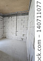 Empty room with aerated concrete walls and electrical wiring during residential construction. 140711077