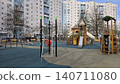 Empty modern playground for caucasian boys and girls sits in a residential urban courtyard area. 140711080