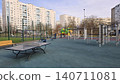 Modern outdoor public fitness ground and ping pong table situated near city residential apartments. 140711081