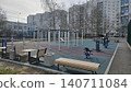 Empty urban gym for all ages and genders near diverse city residential apartment buildings. 140711084