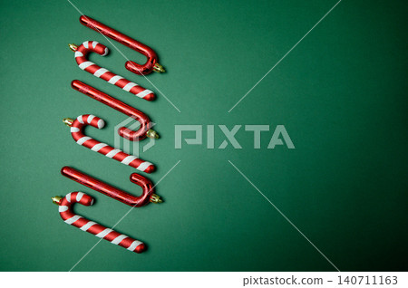 Festive Christmas Baubles on Emerald Green Background Festive Christmas Baubles on Emerald Green Background 140711163