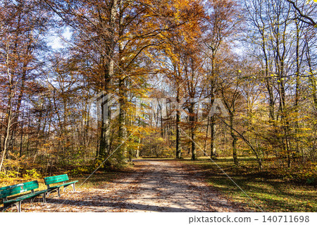 Golden autumn view in famous Munich relax place - Englischer Garten. Munich, Bavaria, Germany Golden autumn view in famous Munich relax place - Englischer Garten. Munich, Bavaria, Germany 140711698