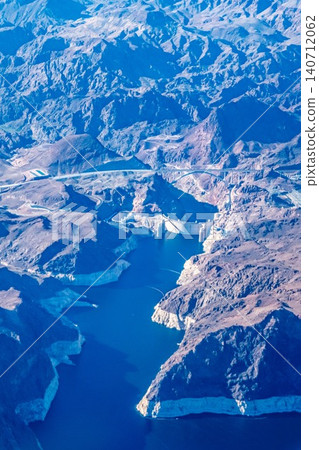 Aerial View of Hoover Dam and Lake Mead Surrounded by Desert Canyon Landscape Along Nevada Aerial View of Hoover Dam and Lake Mead Surrounded by Desert Canyon Landscape Along Nevada 140712062
