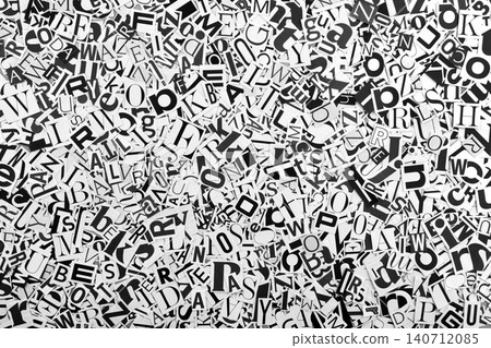 Pile of many black and white letters from newspapers and magazines. Typography background composition 140712085