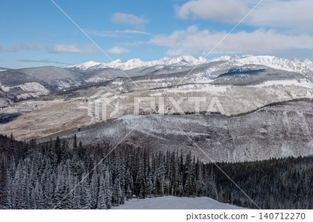 Rocky Mountains Colorado Panoramic Winter Landscape with Snow Covered Ridges Forested Valleys Rocky Mountains Colorado Panoramic Winter Landscape with Snow Covered Ridges Forested Valleys 140712270