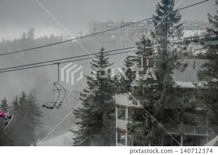 Snowshoe West Virginia Ski Resort in Fog with Chairlift Snow Covered Trees and Low Visibility  140712374