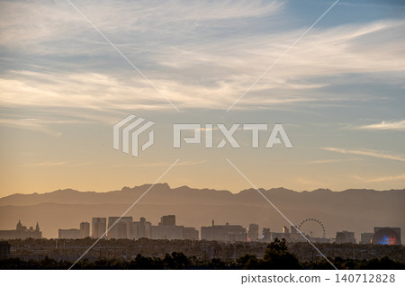 Las Vegas Nevada Skyline with Stratosphere Tower and Desert Mountain Backdrop Las Vegas Nevada Skyline with Stratosphere Tower and Desert Mountain Backdrop 140712828