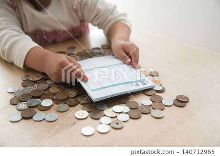 A child's hands calculating money A child's hands calculating money 140712965