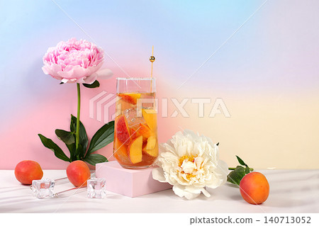 Modern still life with peonies and cocktail or tea with apricot, peach and ice cubes on sunny elegant background, summer party concept, minimalist abstract background for alcoholic drinks presentation Modern still life with peonies and cocktail or tea with apricot, peach and ice cubes on sunny elegant background, summer party concept, minimalist abstract background for alcoholic drinks presentation 140713052