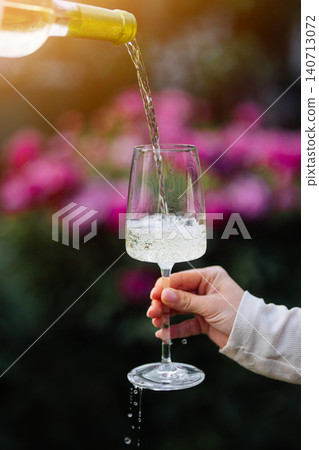 Woman Enjoying White Wine During Luxury Outdoor Experience. Wedding Reception 140713072
