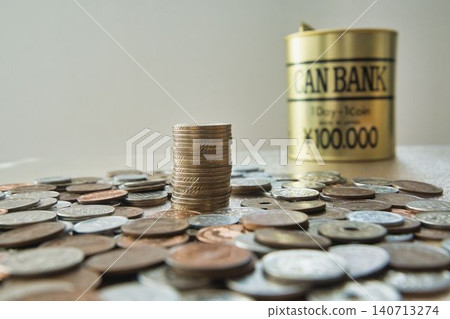 A pile of coins and a piggy bank A pile of coins and a piggy bank 140713274