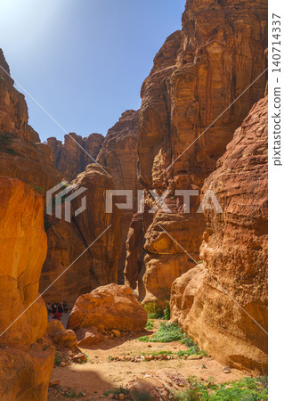 Petra, Wadi Musa, Jordan - Mar 06 2023, Siq Gorge, a narrow winding passage in canyon, vertically, Petra, Wadi Musa, Jordan Petra, Wadi Musa, Jordan - Mar 06 2023, Siq Gorge, a narrow winding passage in canyon, vertically, Petra, Wadi Musa, Jordan 140714337