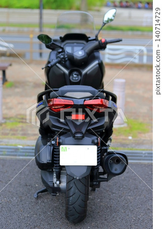 A parked big scooter A parked big scooter 140714729