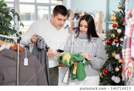 couple chooses wool sweaters 140714813