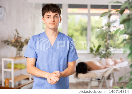 Portrait of happy male masseur in spa salon Portrait of happy male masseur in spa salon 140714814