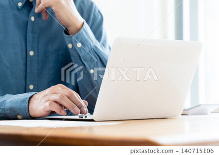 Hand of a man working on a computer Hand of a man working on a computer 140715106