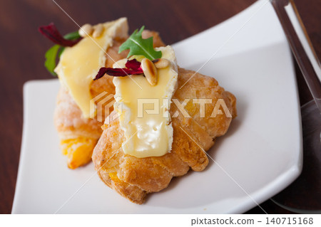 Dessert of french cuisine, mini croissant with camembert cheese Dessert of french cuisine, mini croissant with camembert cheese 140715168