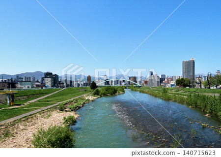 In 2026, the Mizuho Bridge and the Toyohira River with downtown Sapporo in the background. In 2026, the Mizuho Bridge and the Toyohira River with downtown Sapporo in the background. 140715623