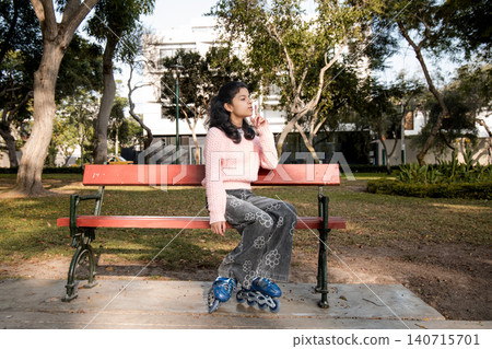 Pre-Teen Girl on Rollerblades Making Silence Gesture on Park Bench Pre-Teen Girl on Rollerblades Making Silence Gesture on Park Bench 140715701