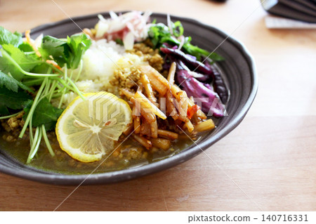 A spicy curry with plenty of condiments. A spicy curry with plenty of condiments. 140716331
